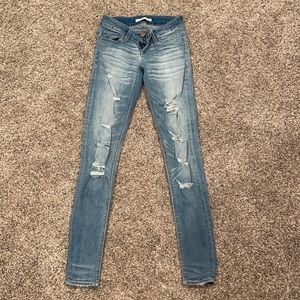 low rise ripped skinny jeans